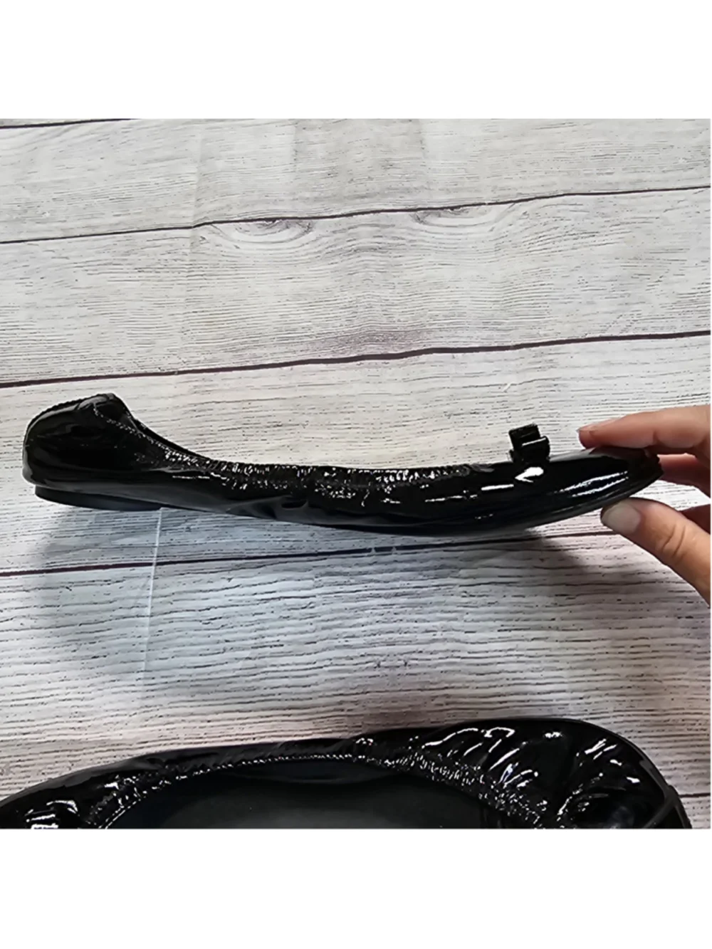 Tory Burch 10M shiny black ballerina flats with black and gold bow accent